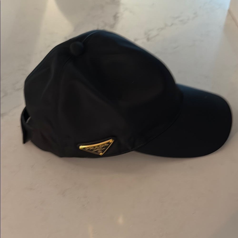 Prada Black Cap with Gold Signature Emblem